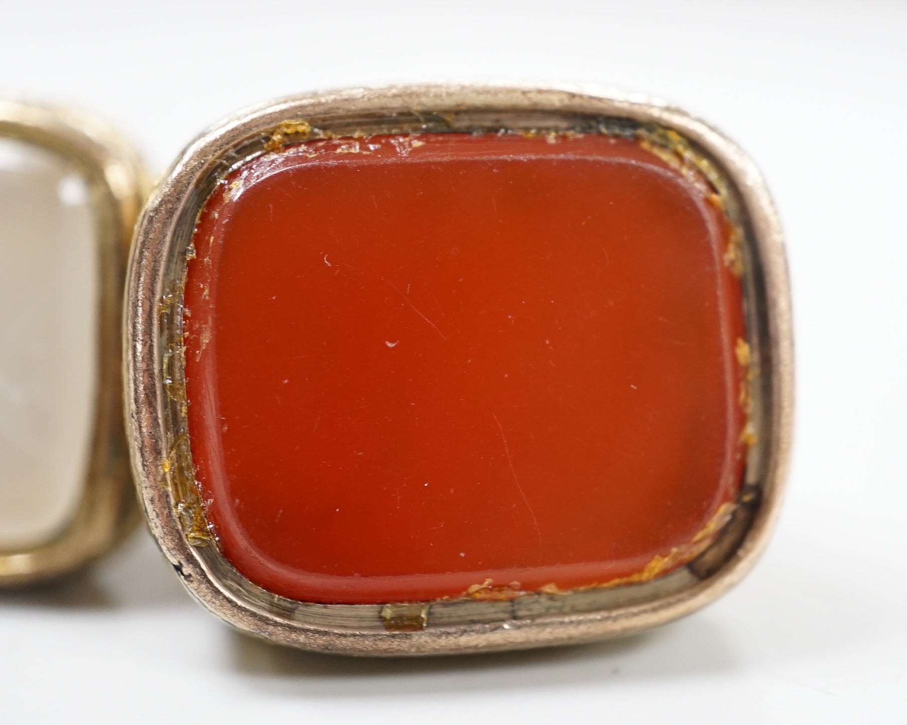 Three assorted Georgian gold plated and chalcedony set fob seals, two with carved matrix, approx. 35mm.